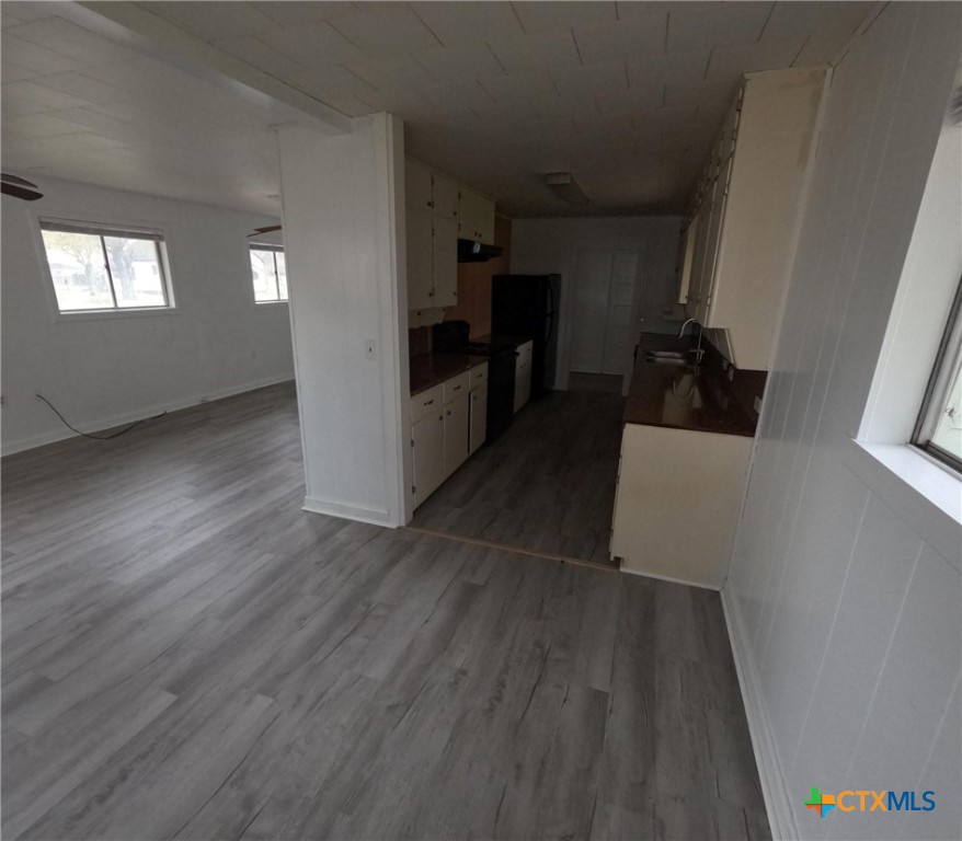218 North 4th Ganado, TX 77962 - Photo 7 of 19 a view of a kitchen from the hallway