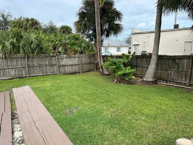 a view of a backyard with a bench