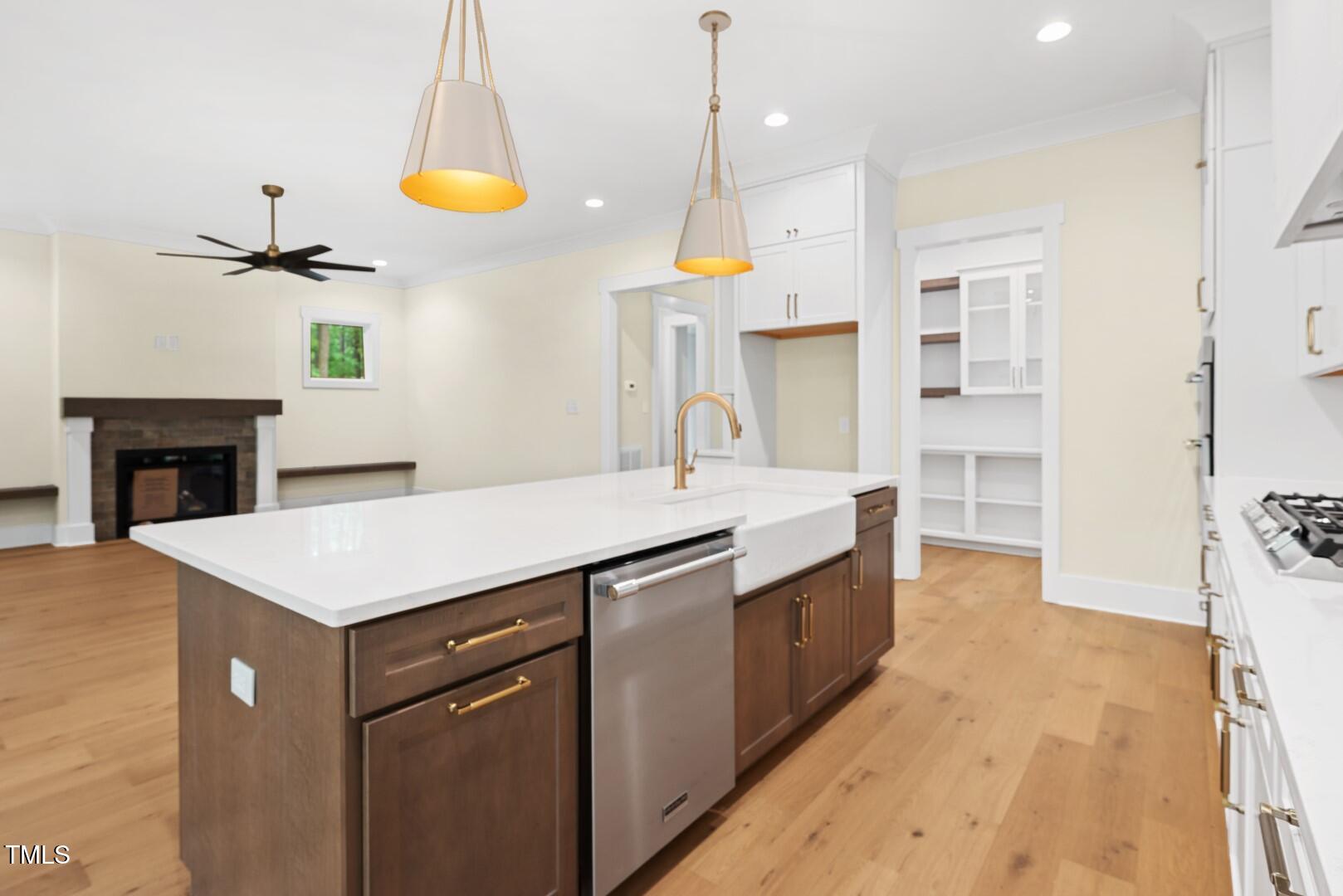 2410 Carpenter Pond Road Raleigh, NC 27613 - Photo 30 of 63 a kitchen that has a lot of cabinets in it