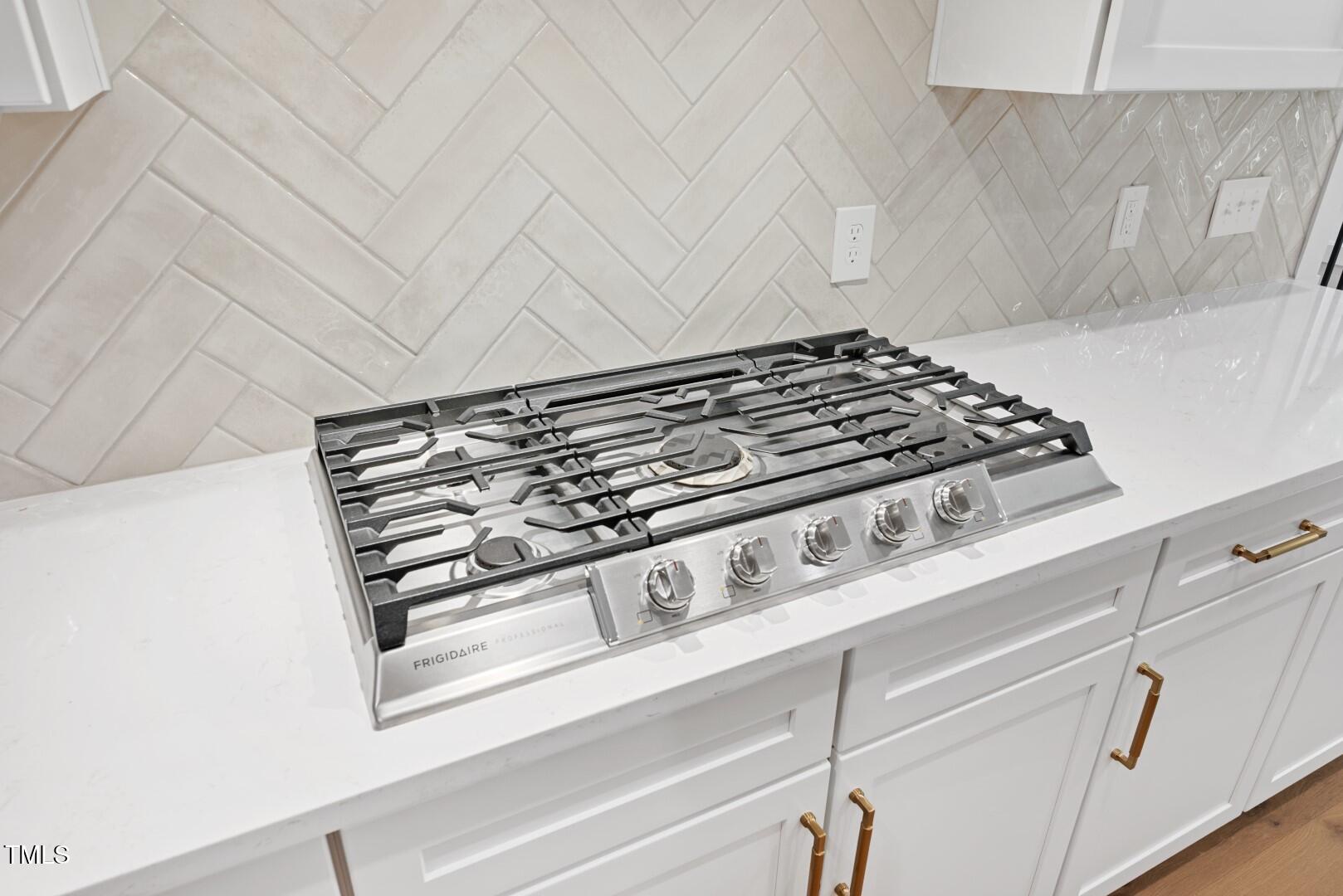 2410 Carpenter Pond Road Raleigh, NC 27613 - Photo 32 of 63 a close view of stove top oven