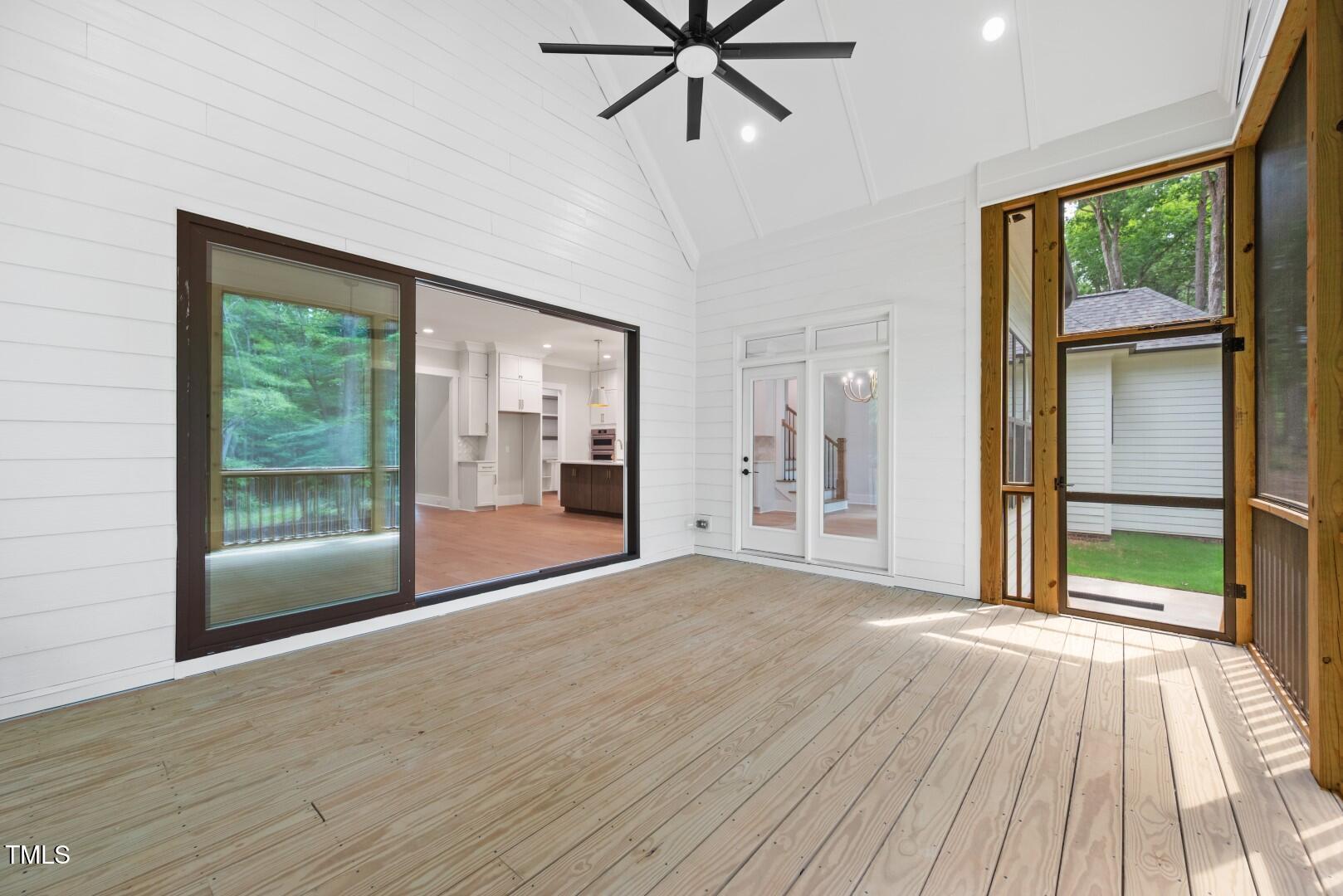 2410 Carpenter Pond Road Raleigh, NC 27613 - Photo 39 of 63 a view of an empty room with glass door and a window