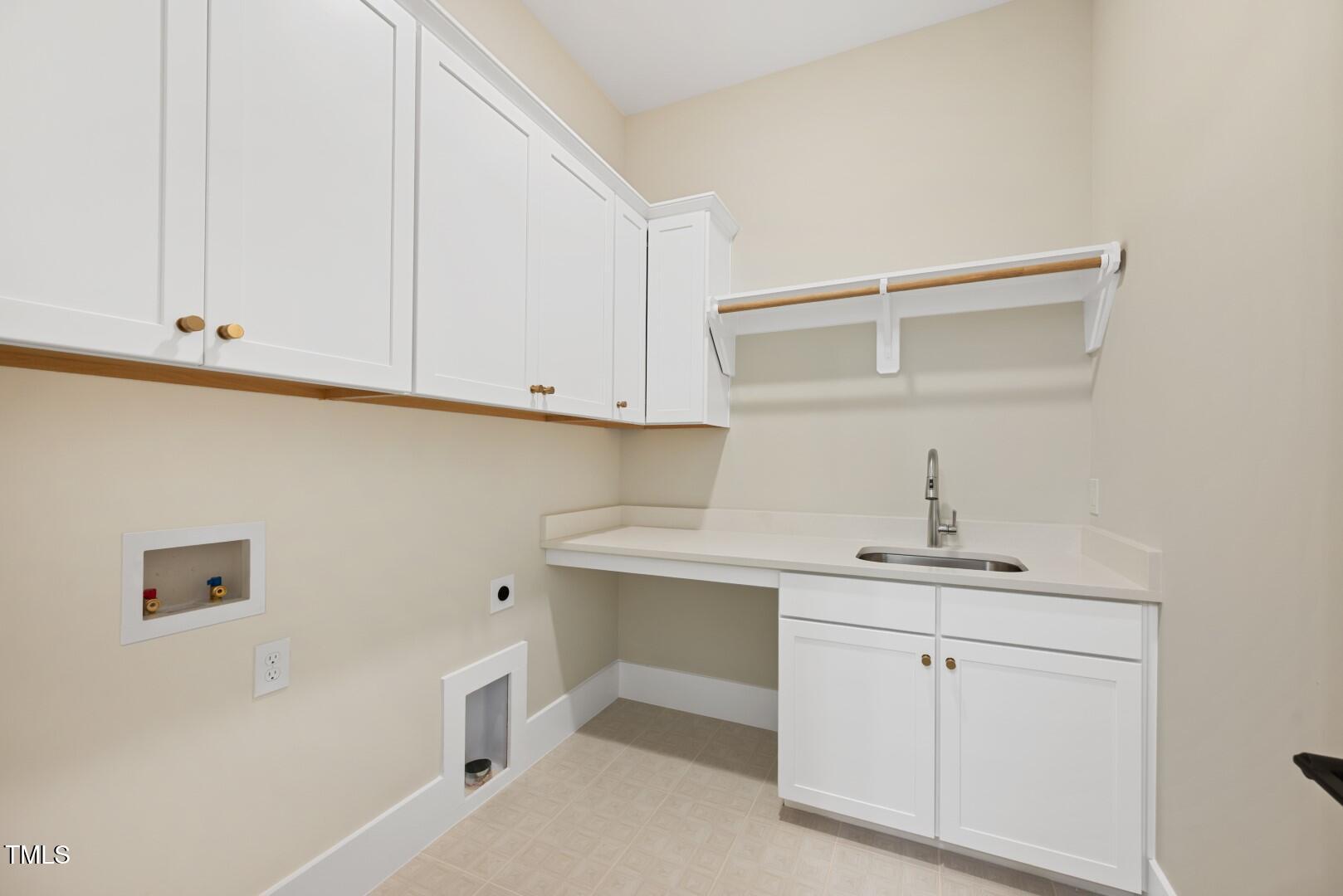2410 Carpenter Pond Road Raleigh, NC 27613 - Photo 48 of 63 a view of cabinets with wooden floor