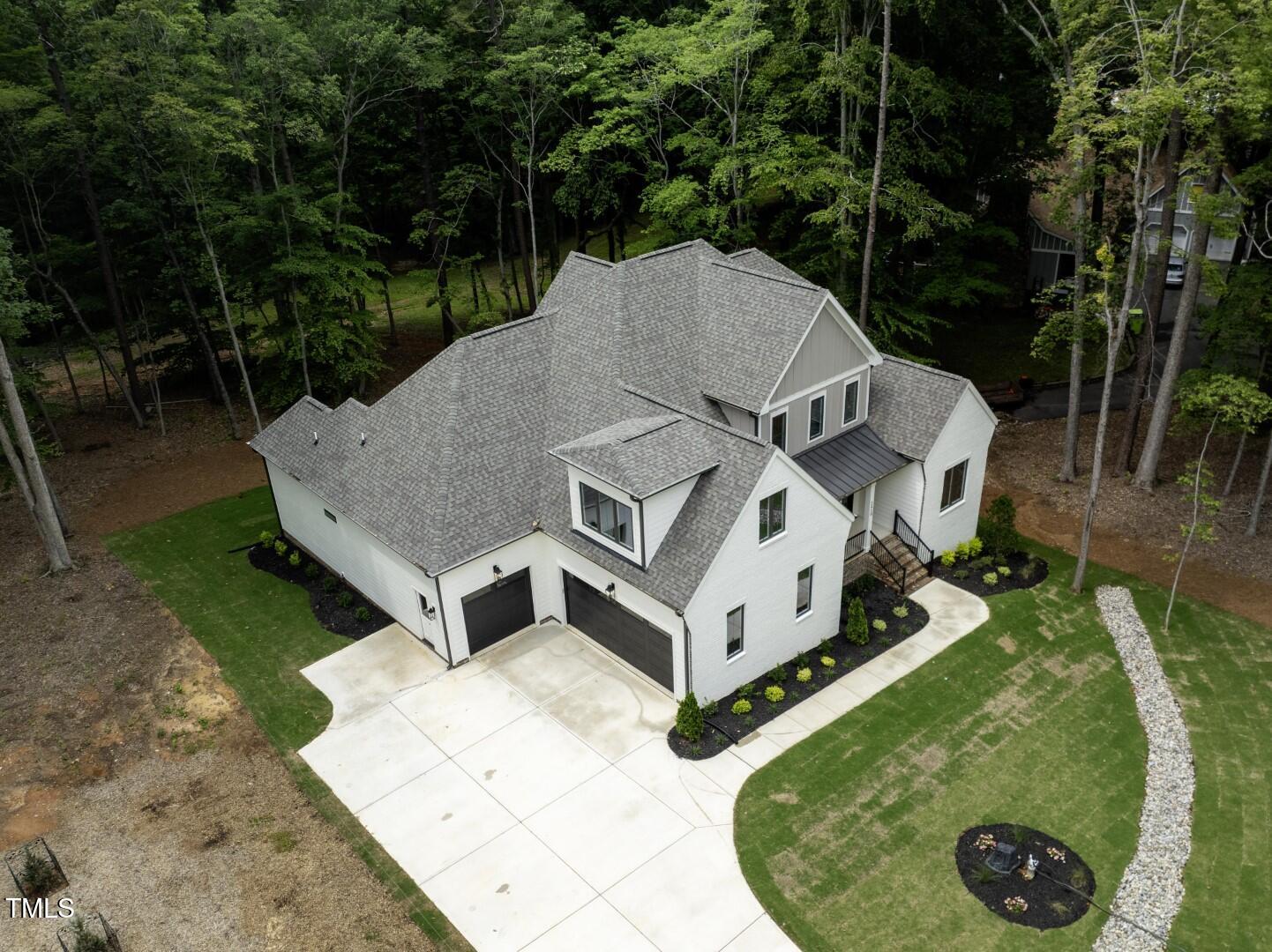 2410 Carpenter Pond Road Raleigh, NC 27613 - Photo 3 of 63 an aerial view of a house with a yard