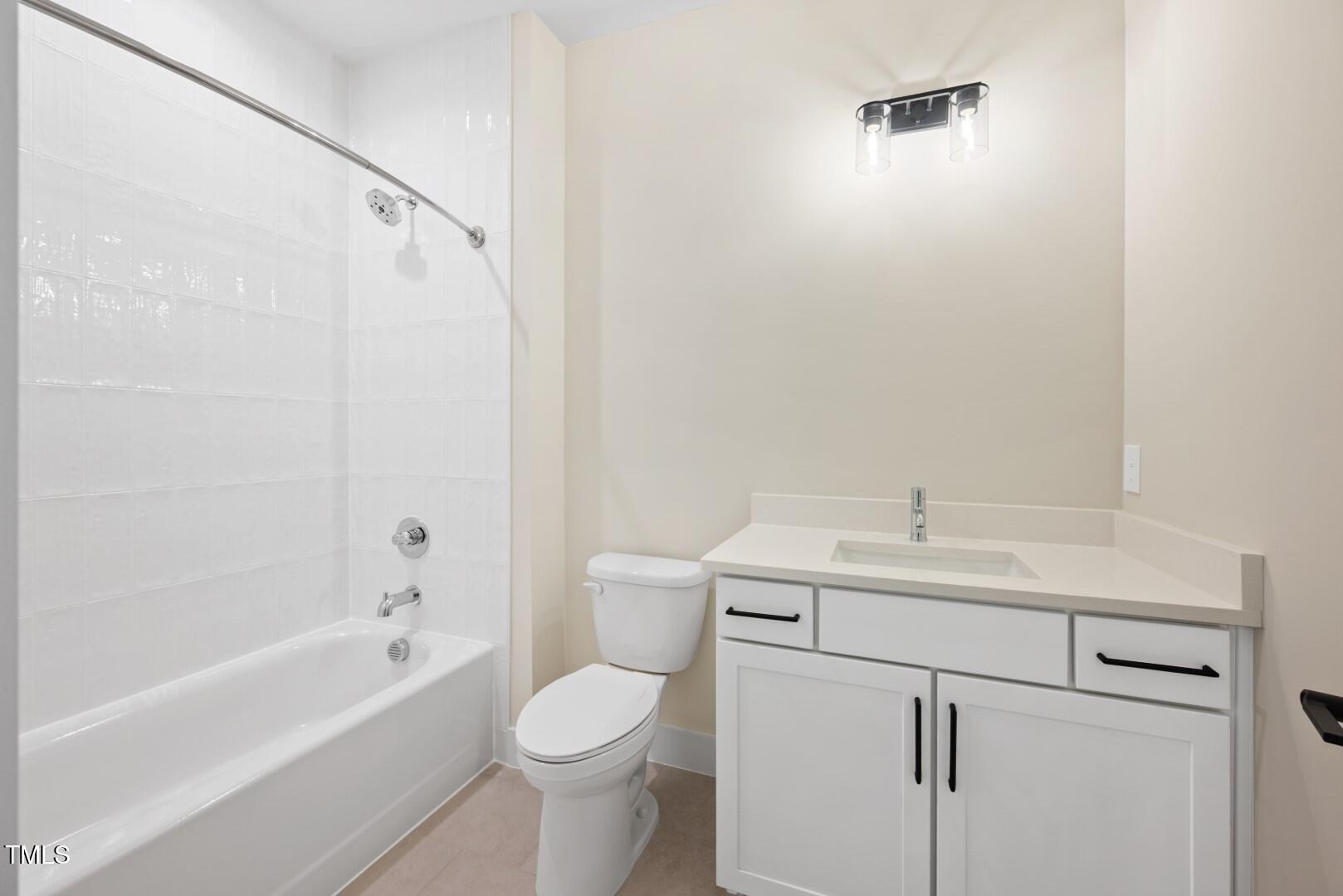 2410 Carpenter Pond Road Raleigh, NC 27613 - Photo 53 of 63 a bathroom with a sink a toilet and shower