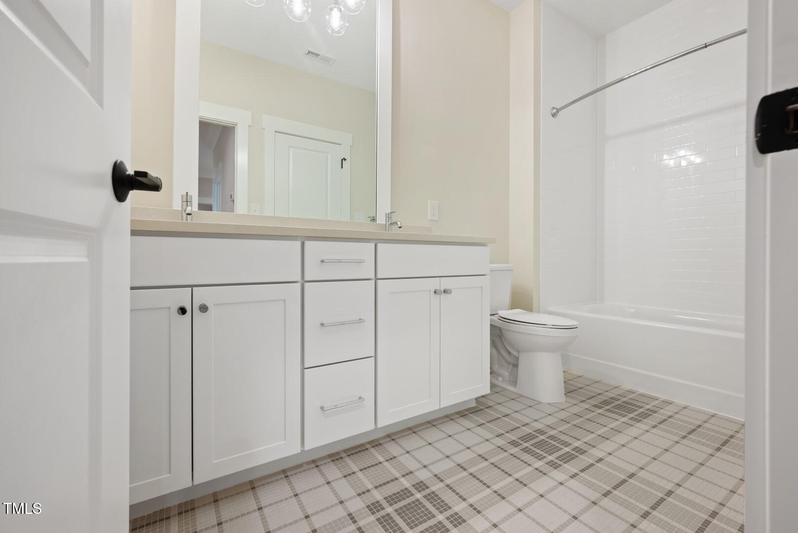 2410 Carpenter Pond Road Raleigh, NC 27613 - Photo 56 of 63 a bathroom with a sink a toilet and shower