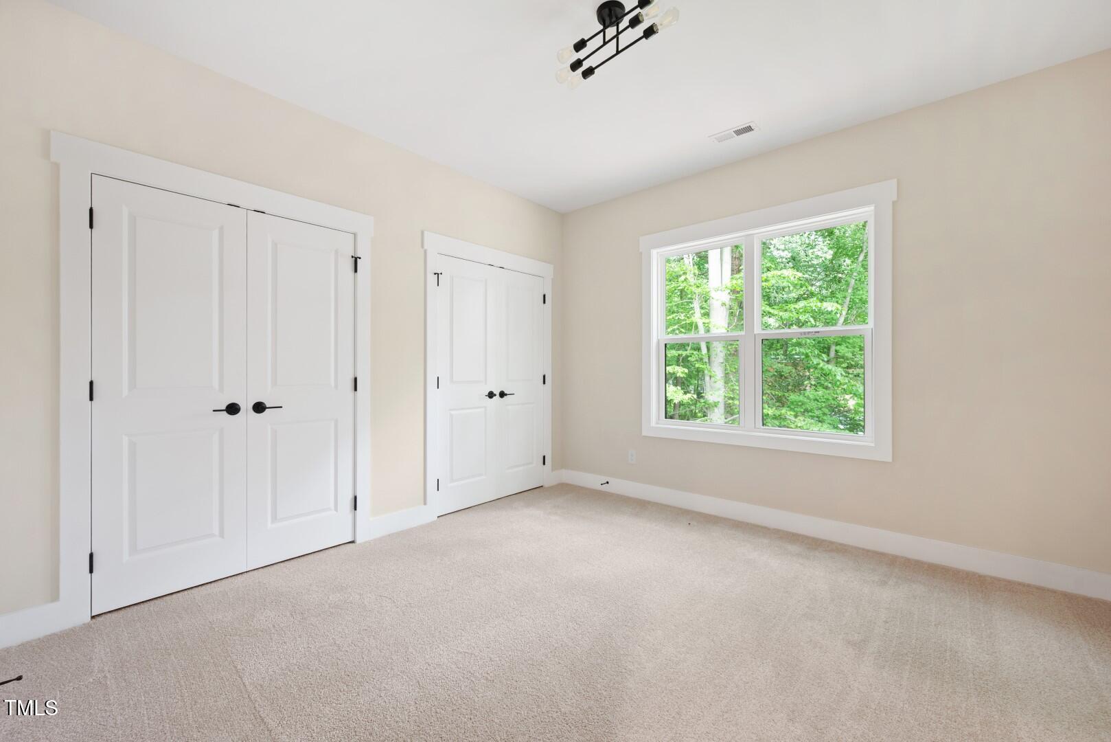 2410 Carpenter Pond Road Raleigh, NC 27613 - Photo 58 of 63 a view of an empty room with a window
