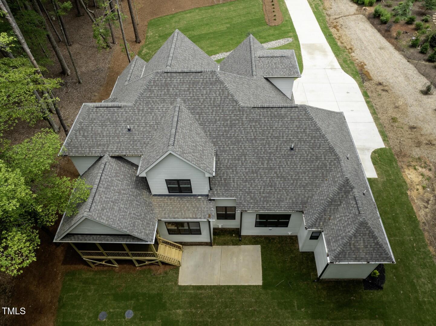 2410 Carpenter Pond Road Raleigh, NC 27613 - Photo 4 of 63 an aerial view of a house with garden