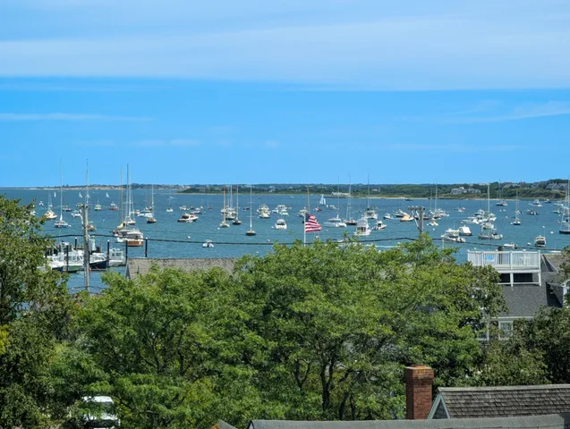 an aerial view of multiple house with outdoor space