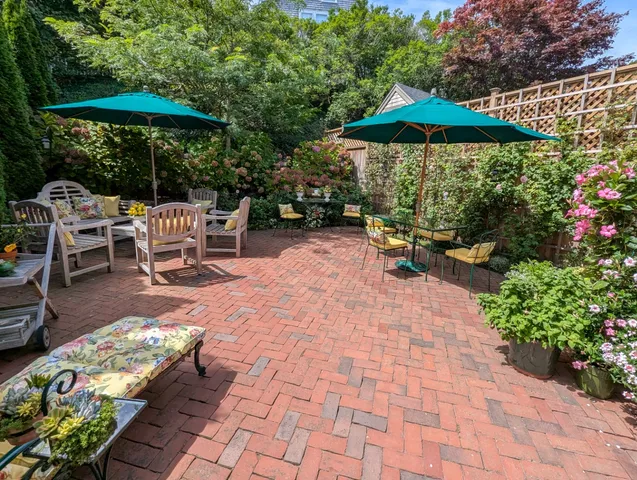 a view of a backyard with sitting area