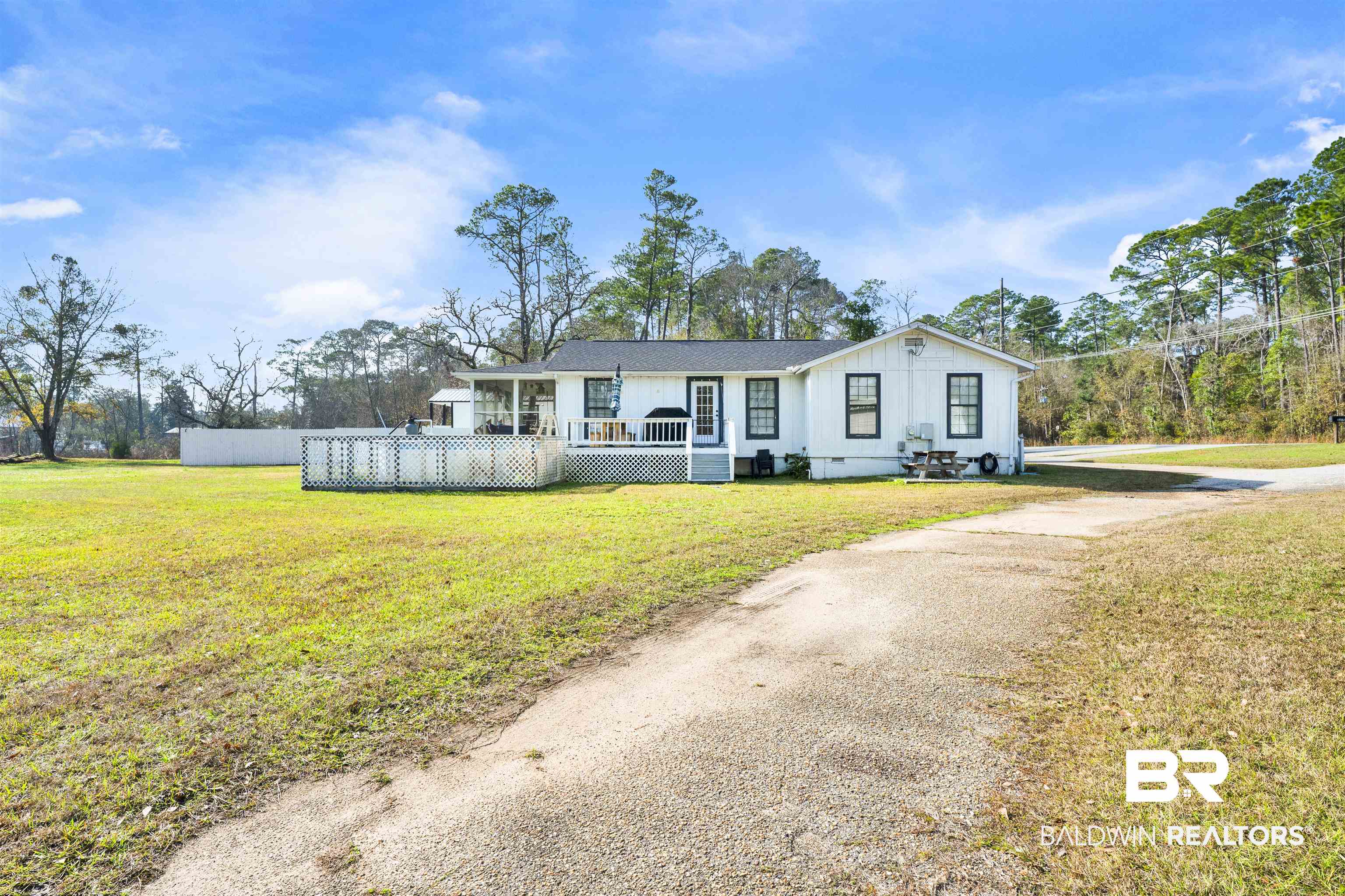 23770 Miflin Road Elberta, AL 36530 - Photo 3 of 38 View of front of property featuring driveway and a wooden deck