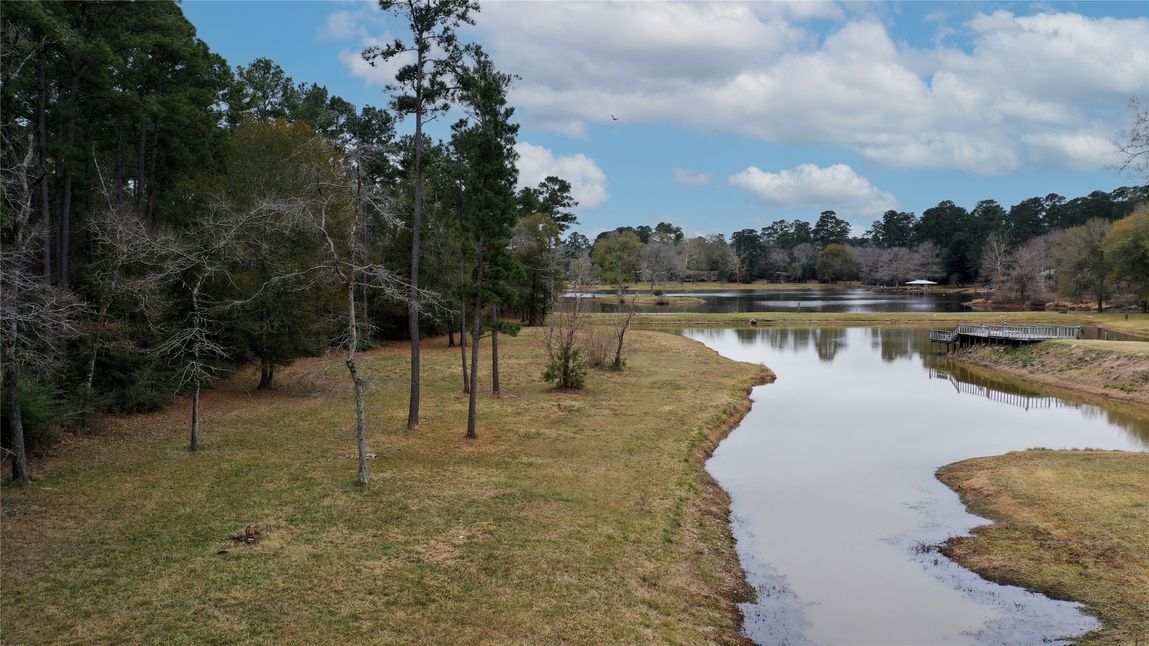 a view of a lake with a yard