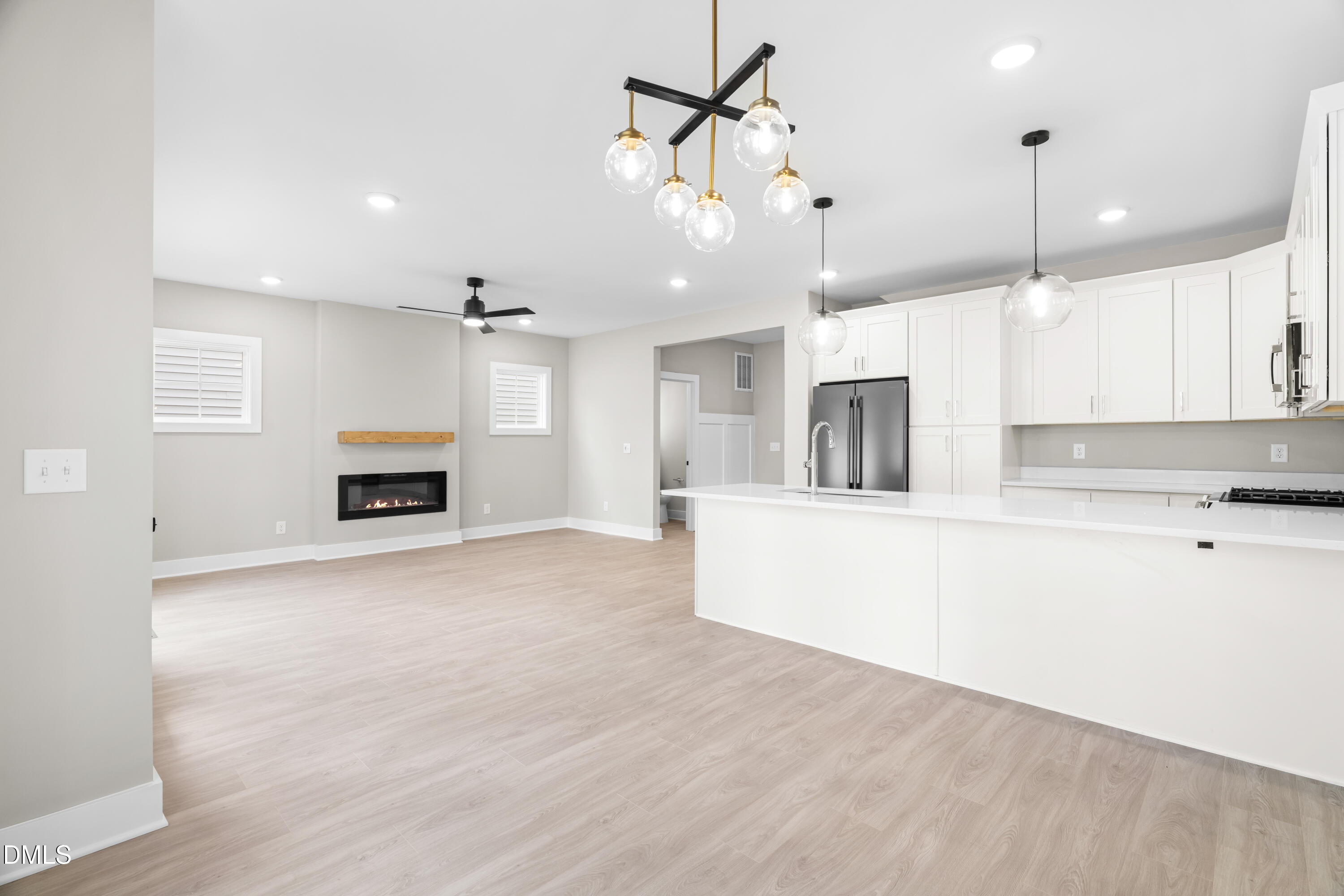 1016 Harper Road Raleigh, NC 27603 - Photo 10 of 46 a large kitchen with kitchen island a stove a sink and a refrigerator