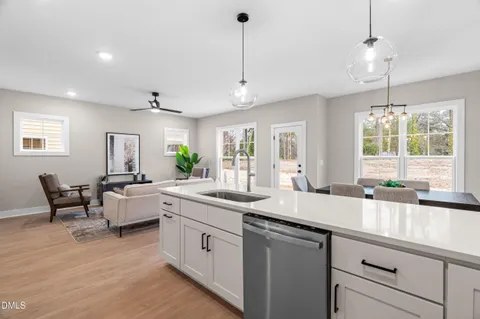 a spacious bedroom with a bed and a window