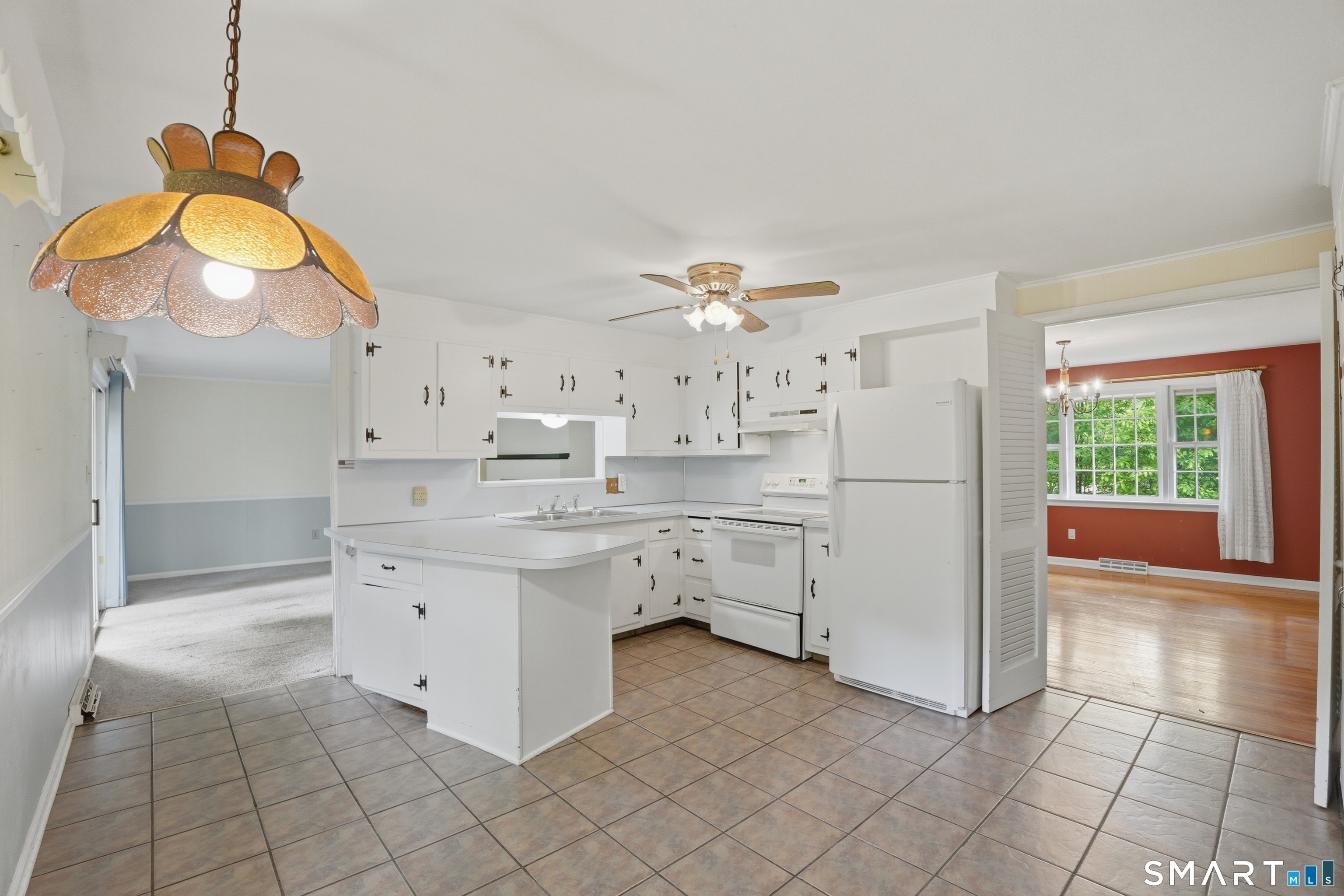 731 Still Hill Road Hamden, CT 06518 - Photo 11 of 40 a kitchen with a cabinets and chandelier