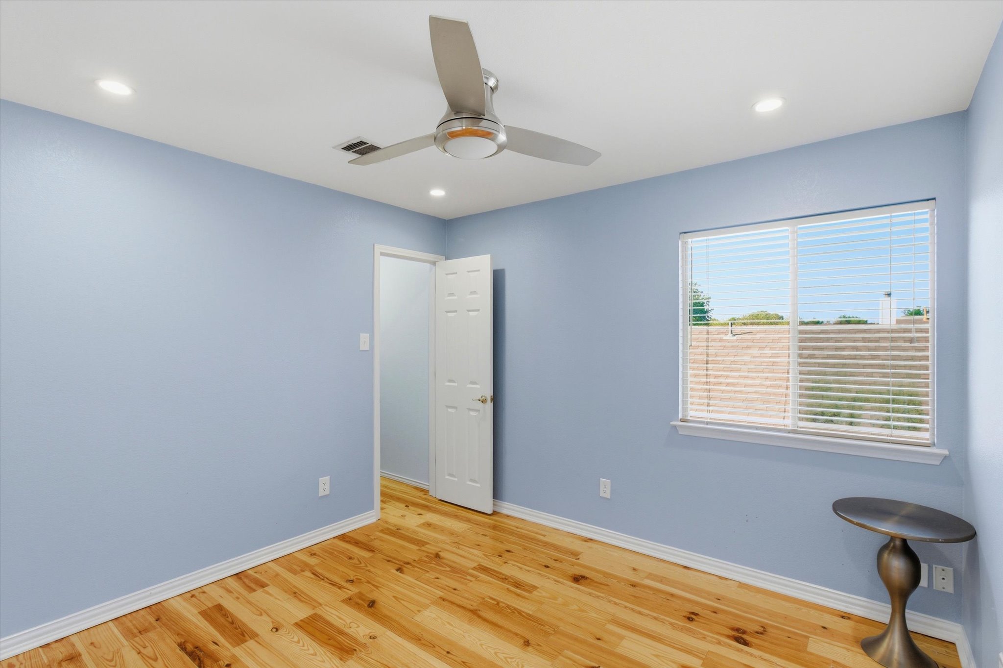 8920 West Hove Loop Austin, TX 78749 - Photo 20 of 39 Room featuring wood-finish flooring, recessed lighting, and a ceiling fan