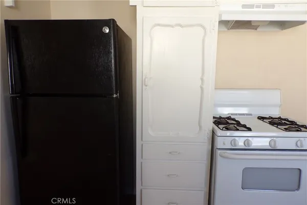 a kitchen with a sink and a window