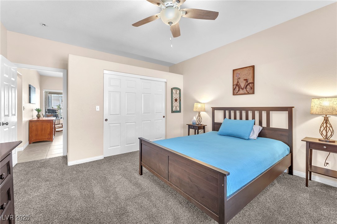 2251 Thoroughbred Road Henderson, NV 89002 - Photo 18 of 60 Bedroom with a closet, light colored carpet, and baseboards