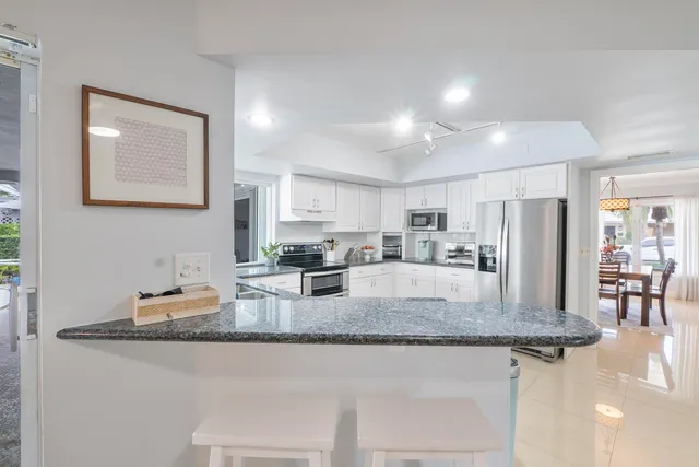 a bedroom with a bed and a desk