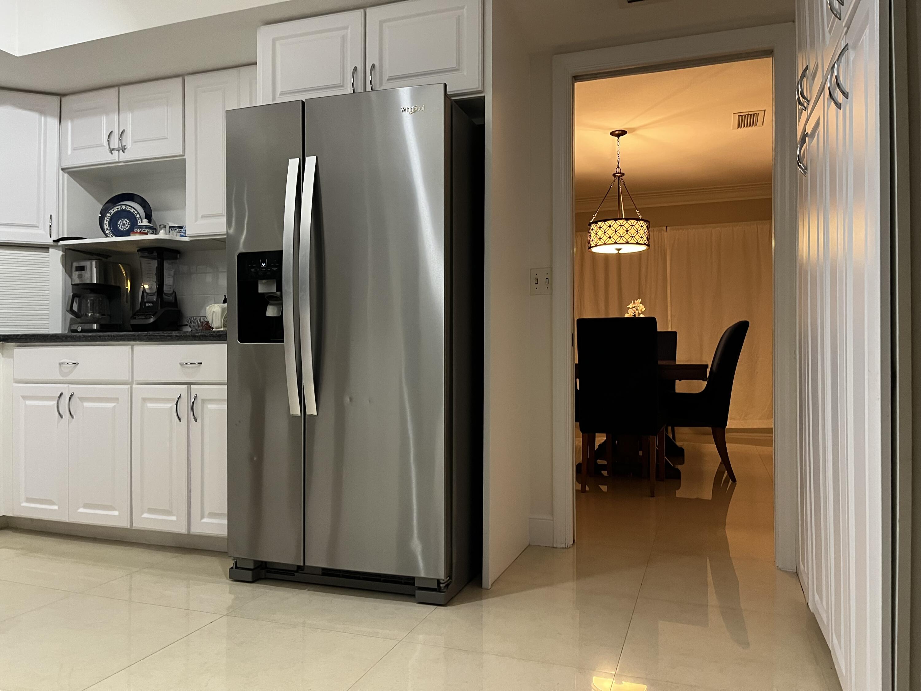 772 Apple Tree Lane Boca Raton, FL 33486 - Photo 15 of 39 772 kitchen and door to dining room