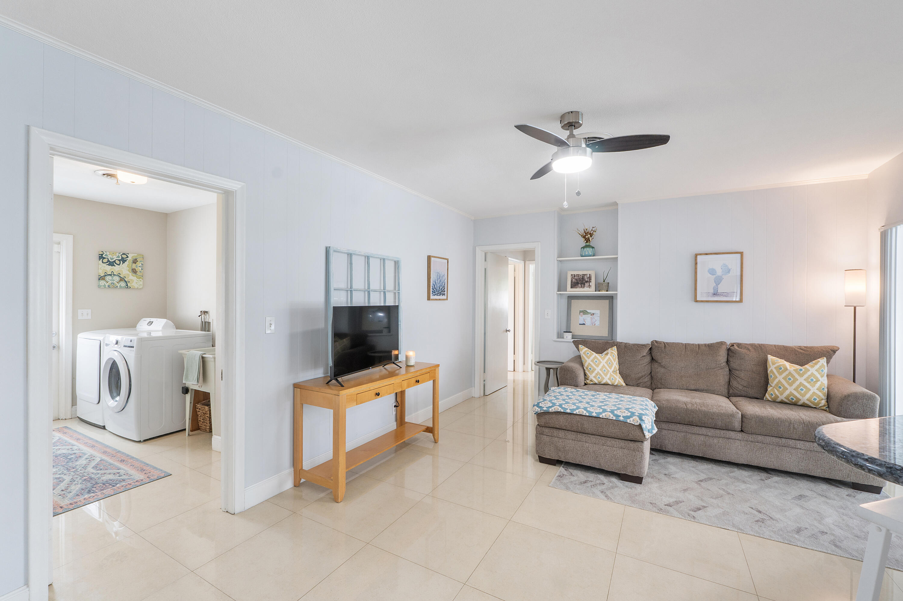 772 Apple Tree Lane Boca Raton, FL 33486 - Photo 18 of 39 a living room with furniture and a flat screen tv