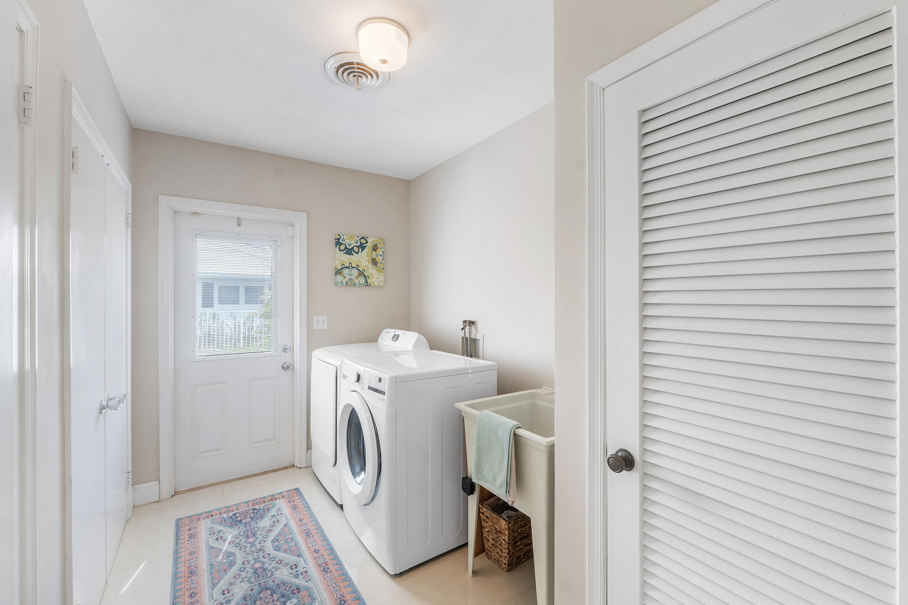 772 Apple Tree Lane Boca Raton, FL 33486 - Photo 19 of 39 a utility room with dryer and washer