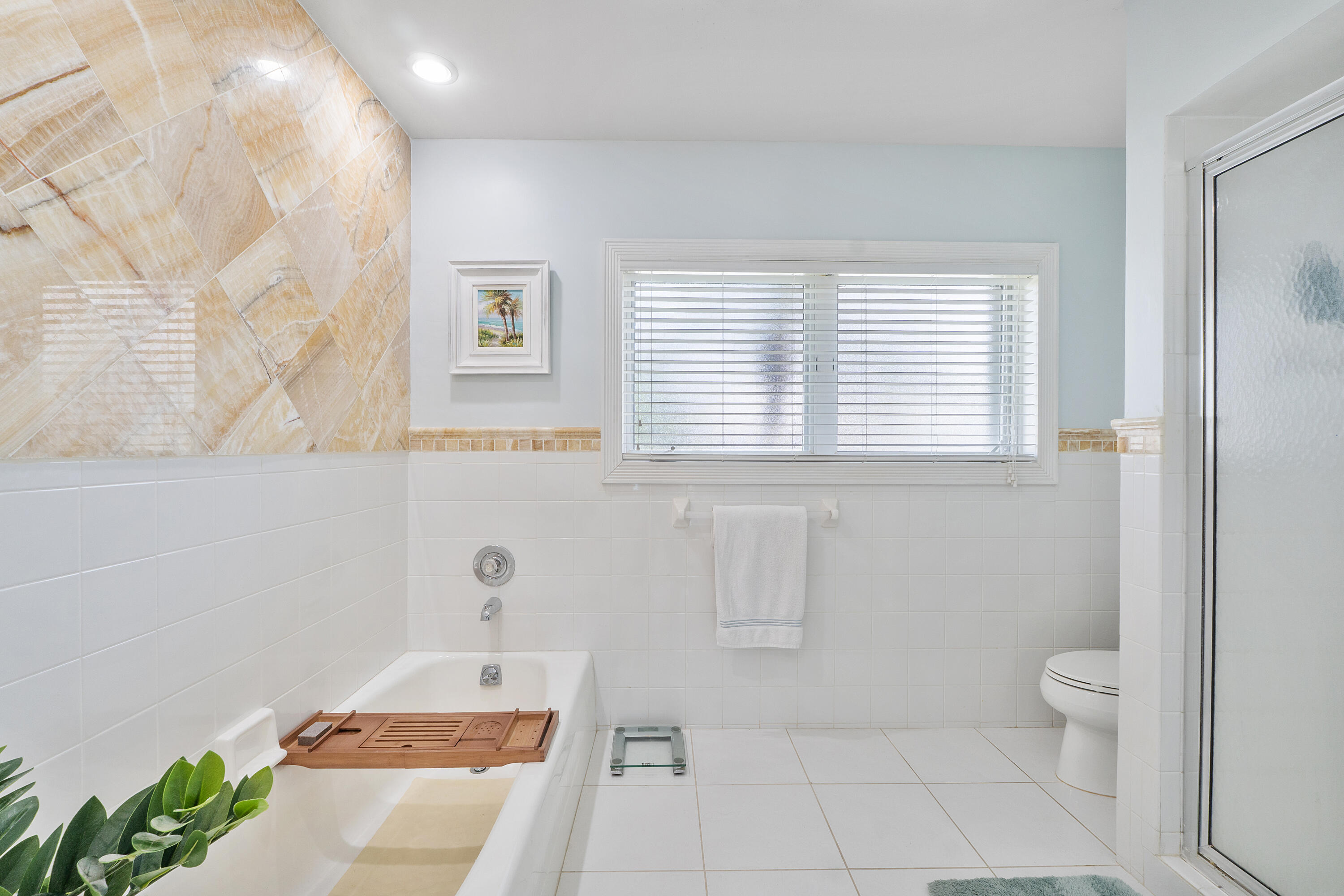 772 Apple Tree Lane Boca Raton, FL 33486 - Photo 22 of 39 a bathroom with a sink a toilet and a window