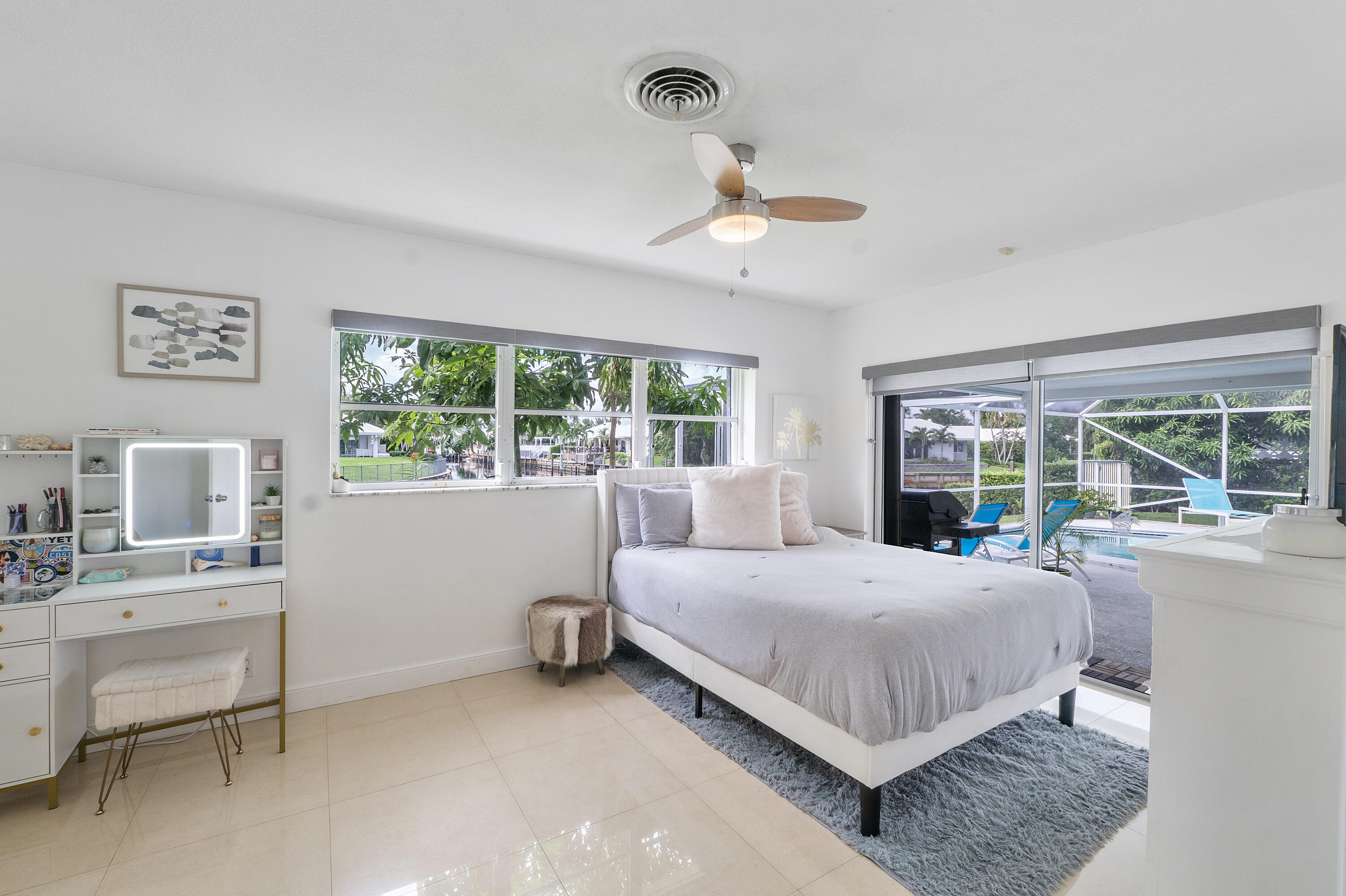 772 Apple Tree Lane Boca Raton, FL 33486 - Photo 27 of 39 a bedroom with a bed and a desk