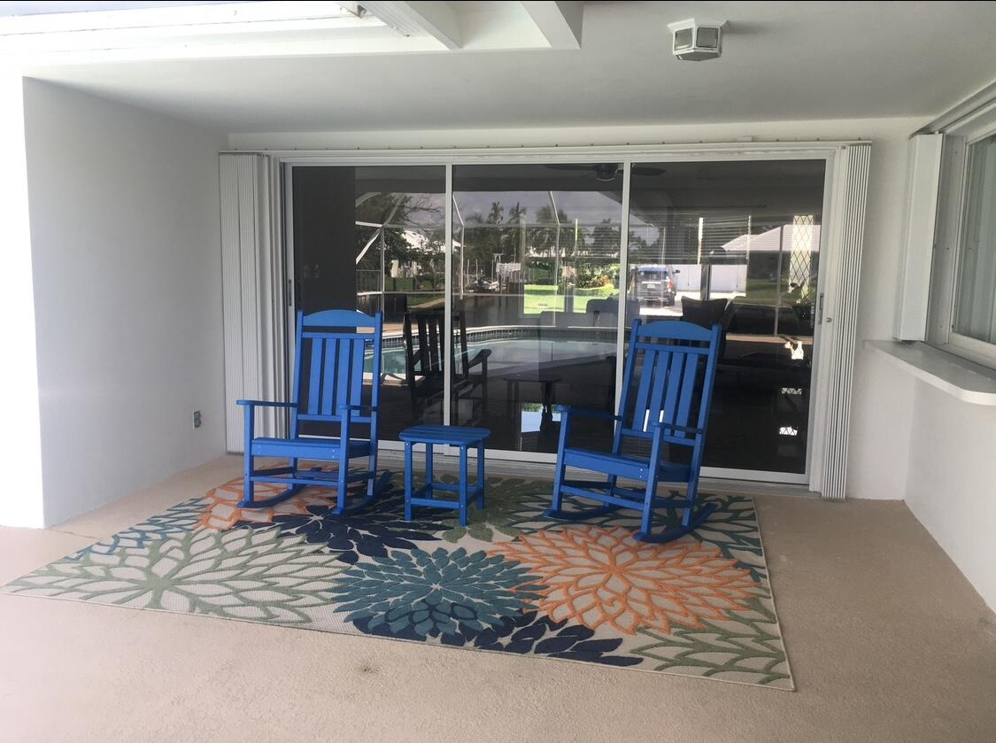 772 Apple Tree Lane Boca Raton, FL 33486 - Photo 37 of 39 a room with lots of wooden furniture and a wooden table