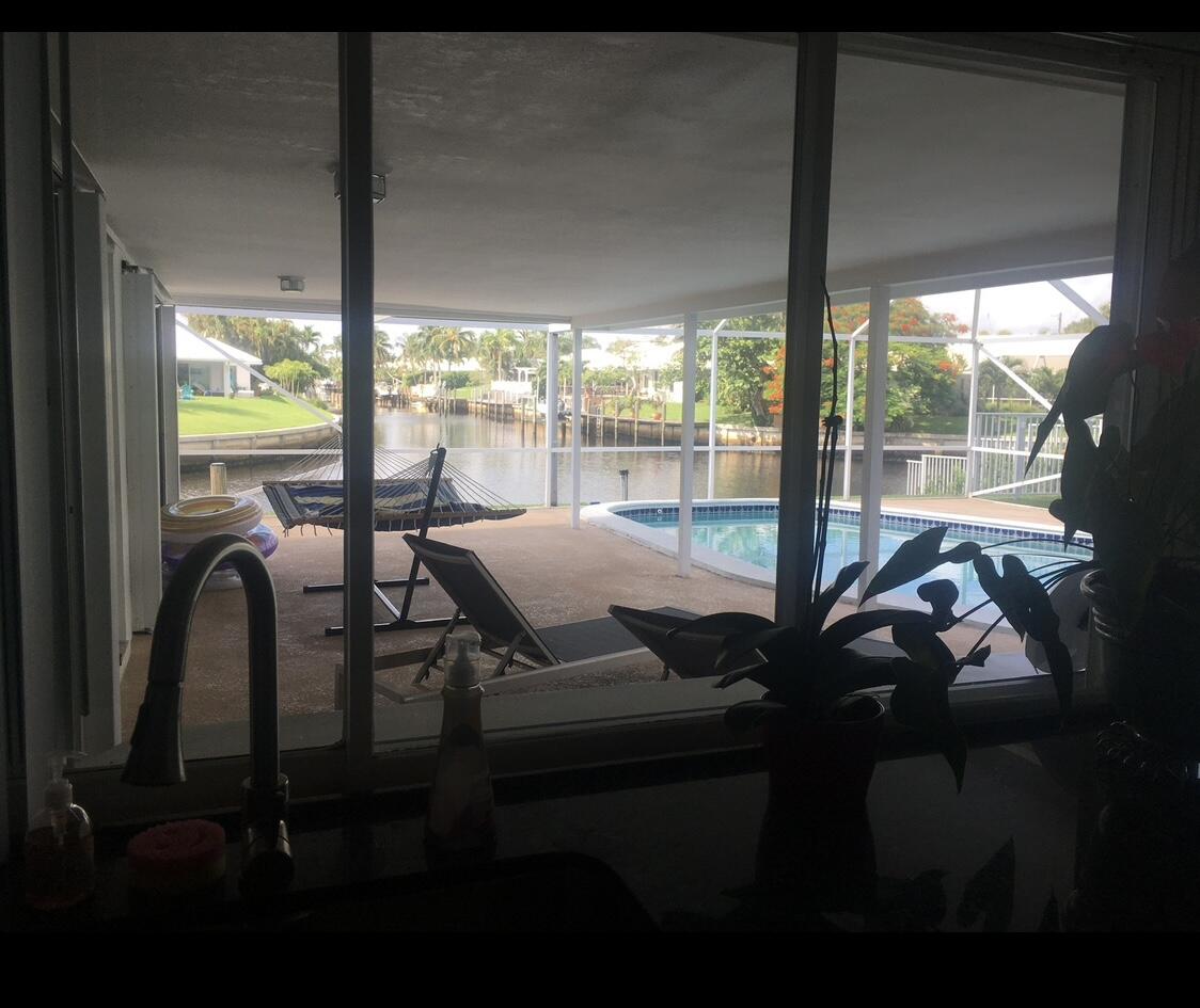 772 Apple Tree Lane Boca Raton, FL 33486 - Photo 38 of 39 a view of a living room and floor to ceiling window or an outdoor dining space with furniture