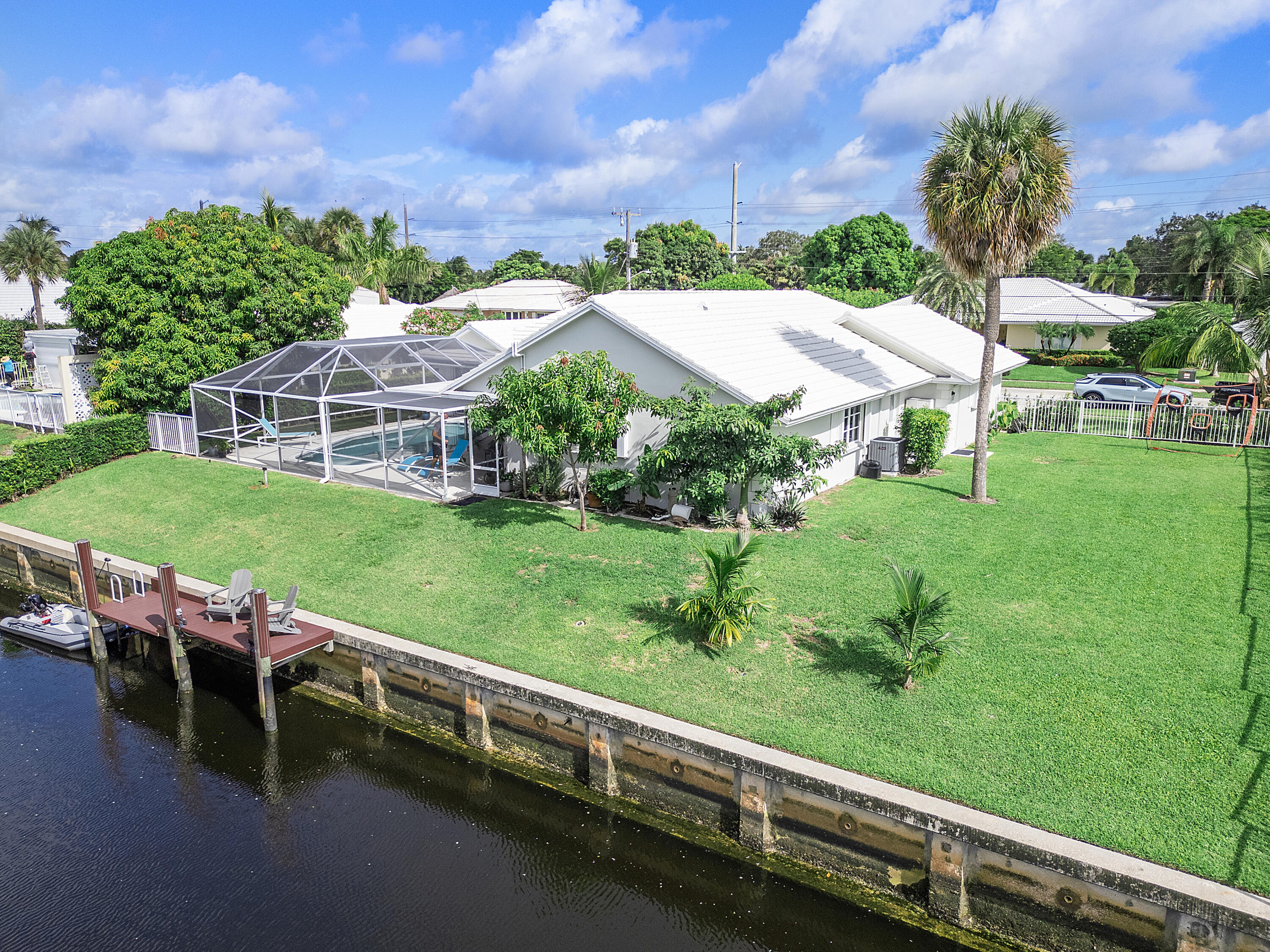 772 Apple Tree Lane Boca Raton, FL 33486 - Photo 4 of 39 a view of a house with a yard