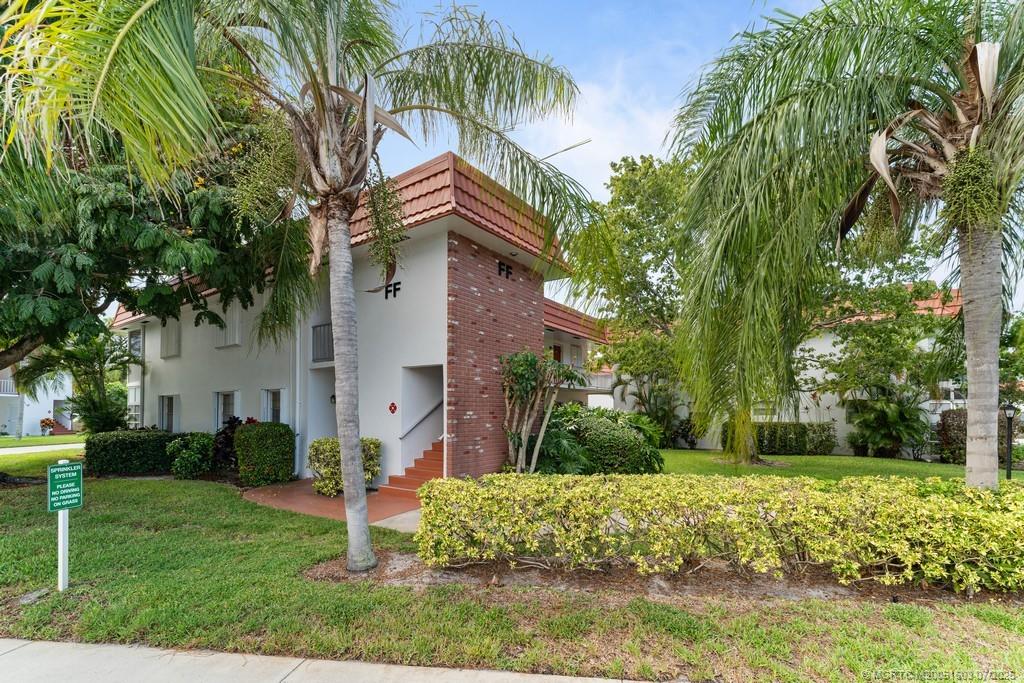 2600 Southeast Ocean Boulevard, Unit FF14 Stuart, FL 34996 - Photo 2 of 26 a front view of a house with garden