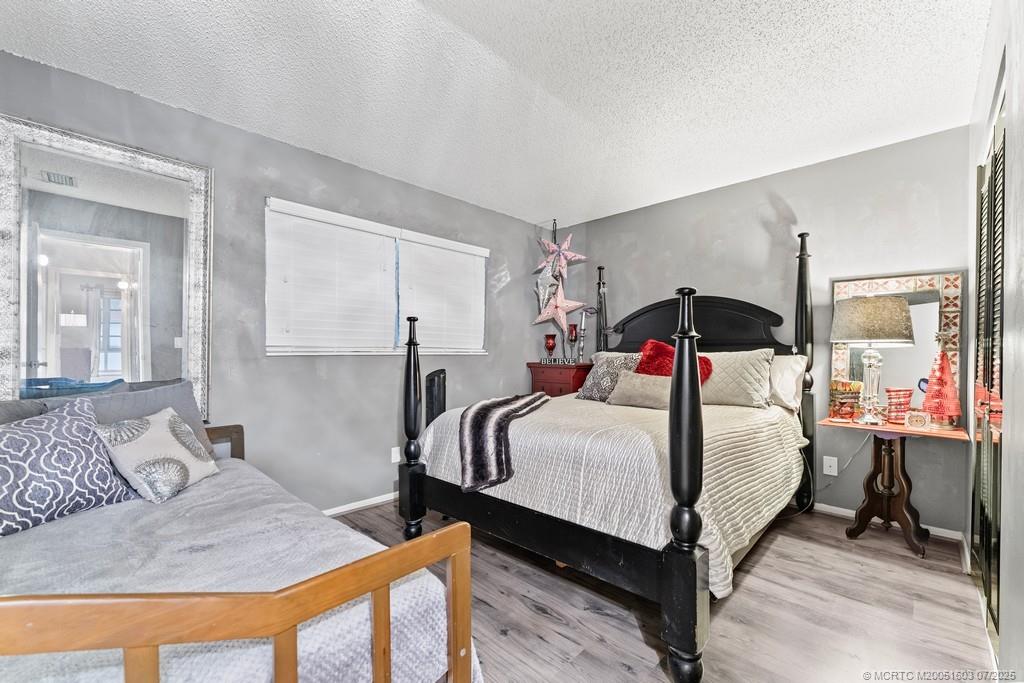 2600 Southeast Ocean Boulevard, Unit FF14 Stuart, FL 34996 - Photo 23 of 26 a bedroom with a bed and window