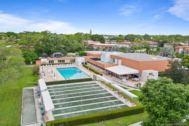 a view of a swimming pool with an outdoor seating