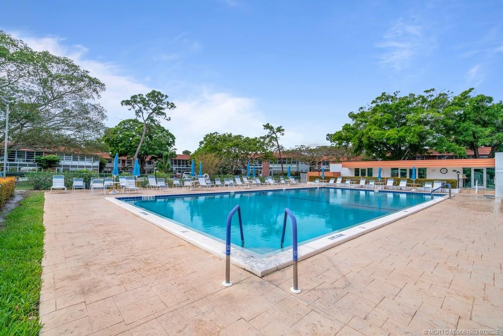 2600 Southeast Ocean Boulevard, Unit FF14 Stuart, FL 34996 - Photo 25 of 26 a view of a swimming pool with a patio
