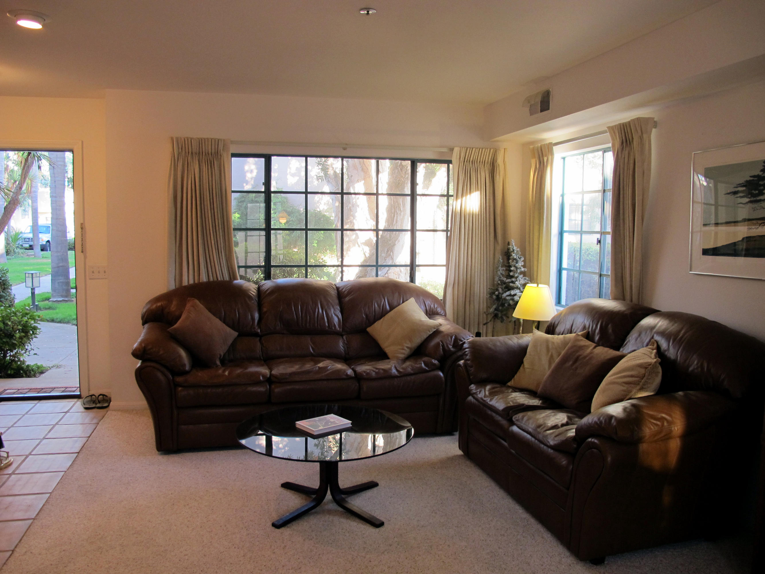 4297 Carpinteria Avenue, Unit 13 Carpinteria, CA 93013 - Photo 9 of 17 a living room with furniture and a large window