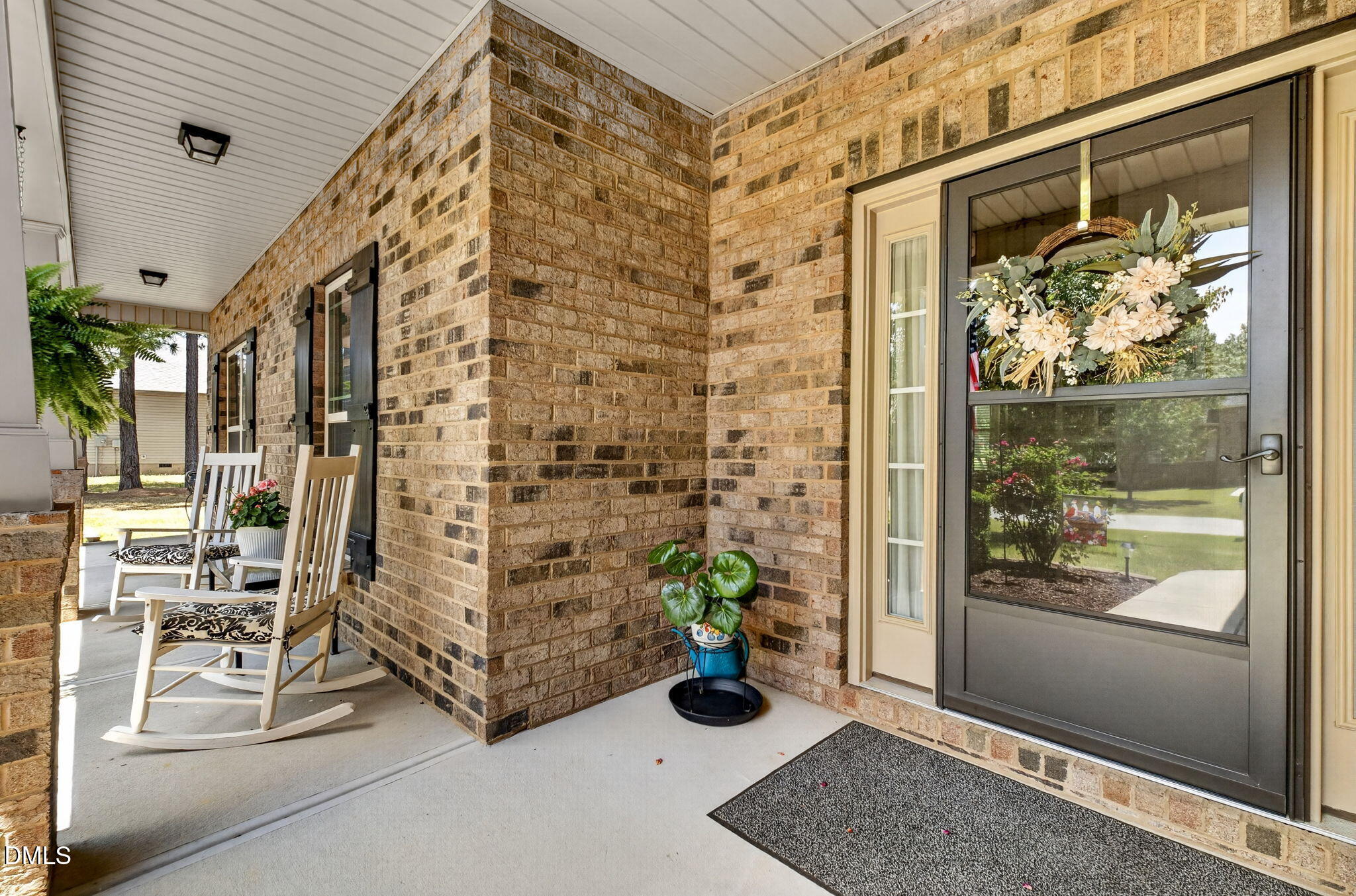 20 Deep Clay Circle Angier, NC 27501 - Photo 5 of 54 a view of an entryway with wooden floor and a potted plant