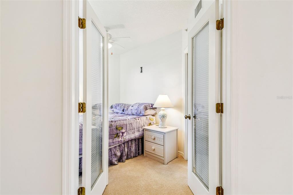 960 Starkey Road, Unit 2203 Largo, FL 33771 - Photo 20 of 53 a bed room with a bed and a closet