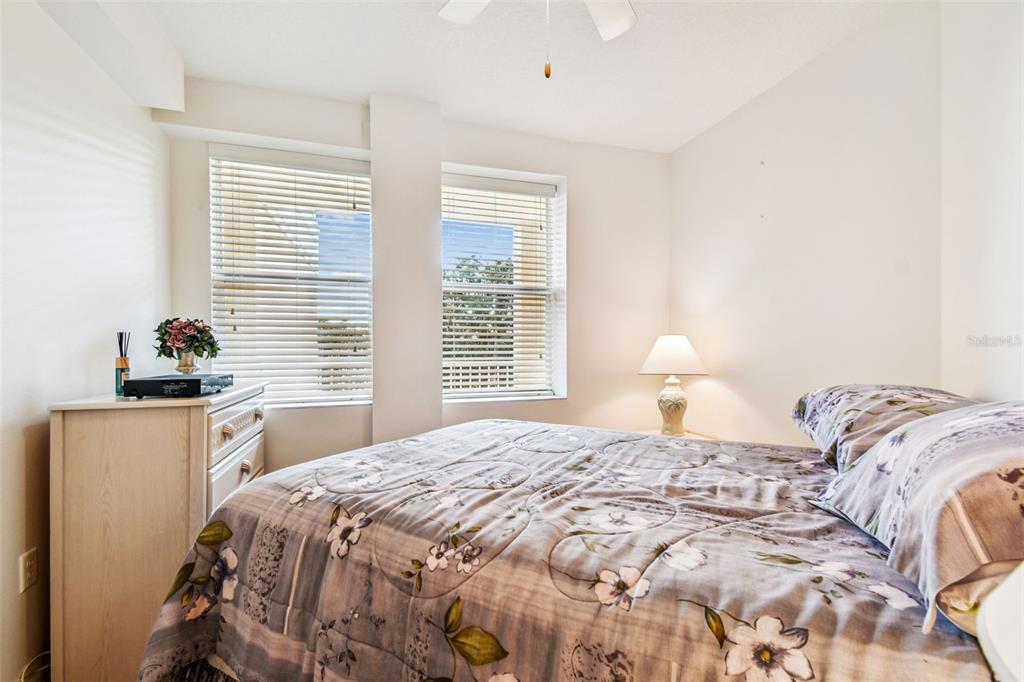 960 Starkey Road, Unit 2203 Largo, FL 33771 - Photo 21 of 53 a bedroom with a bed and a window