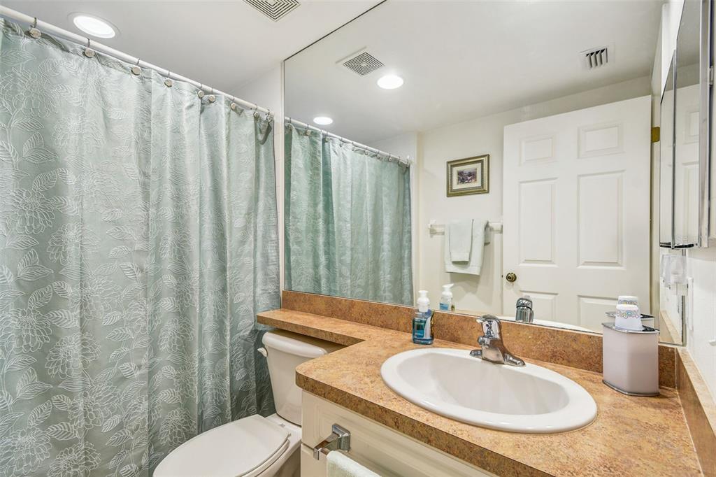 960 Starkey Road, Unit 2203 Largo, FL 33771 - Photo 22 of 53 a bathroom with a sink toilet and shower