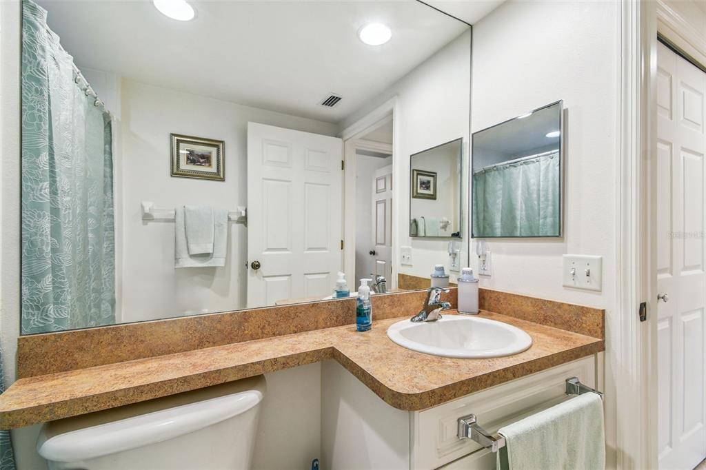 960 Starkey Road, Unit 2203 Largo, FL 33771 - Photo 29 of 53 a bathroom with a sink and a mirror