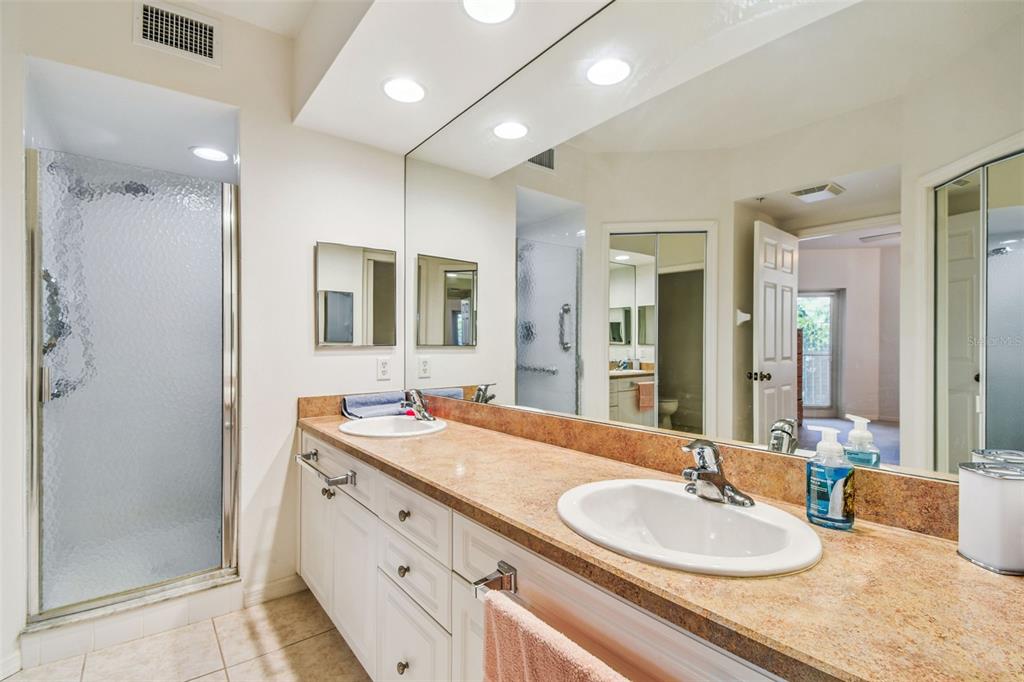960 Starkey Road, Unit 2203 Largo, FL 33771 - Photo 30 of 53 a bathroom with a granite countertop sink double and mirror