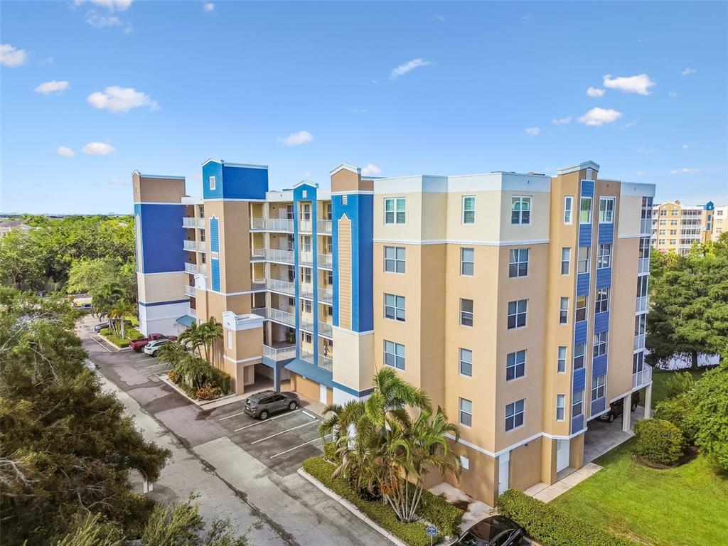 960 Starkey Road, Unit 2203 Largo, FL 33771 - Photo 4 of 53 a view of a building with a yard