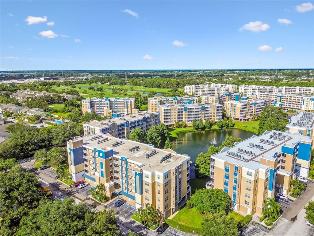 960 Starkey Road, Unit 2203 Largo, FL 33771 - Photo 5 of 53 a view of lake with city and green space