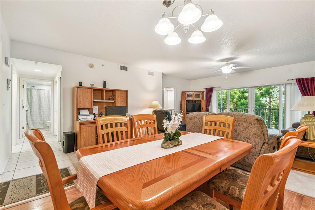 960 Starkey Road, Unit 2203 Largo, FL 33771 - Photo 9 of 53 a view of a dining room with furniture window and outside view