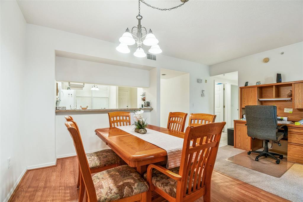 960 Starkey Road, Unit 2203 Largo, FL 33771 - Photo 10 of 53 a view of a dining room with furniture
