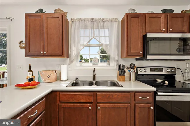 a bedroom with a bed and a flat tv screen on the dresser