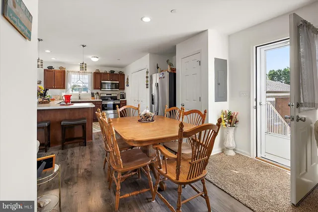 a view of a dining room with furniture and window