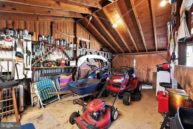 a view of an house with backyard space and a tree