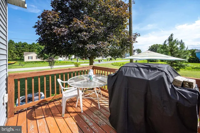 a view of a house with backyard porch and sitting area
