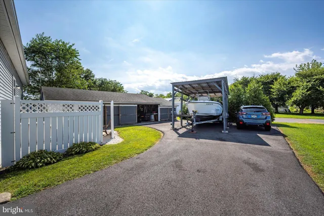 a view of a house with backyard porch and sitting area